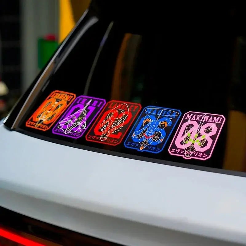 Five colorful neon reflective car stickers of evangelion eva-01 units on the rear window of a white car