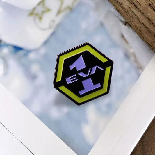 Hexagonal enamel pin featuring evangelion eva 1 logo in purple and yellow with rubber clutch collectible jewelry