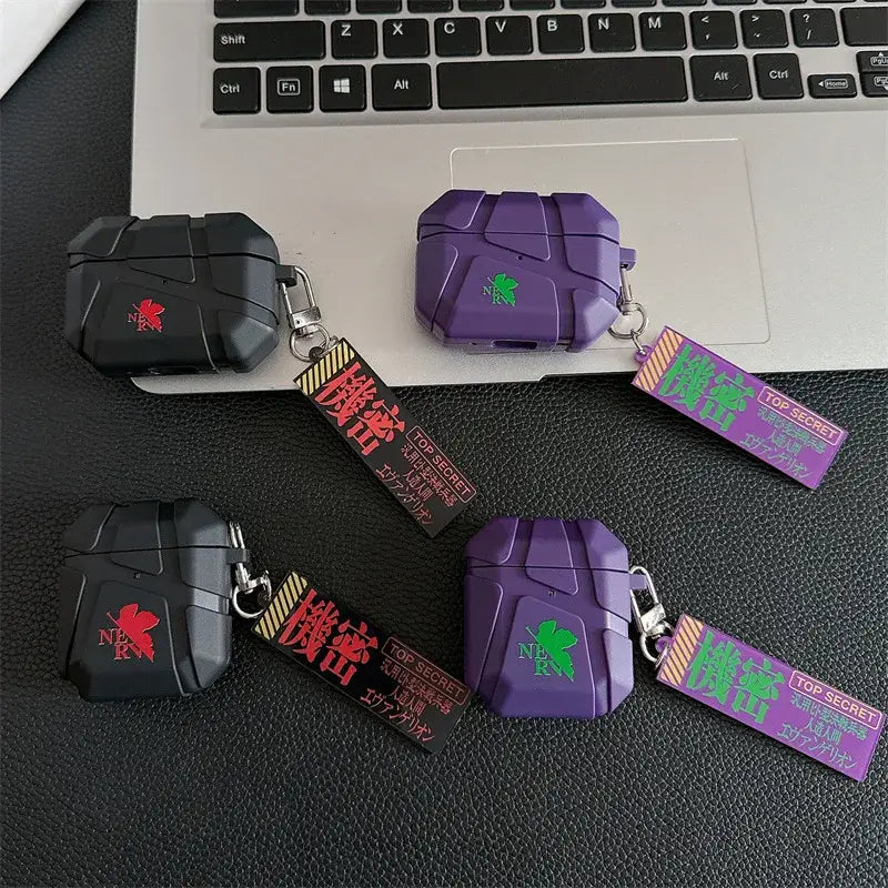 Purple and black silicone evangelion eva airpods case with green and red logo decals and matching keychain tags