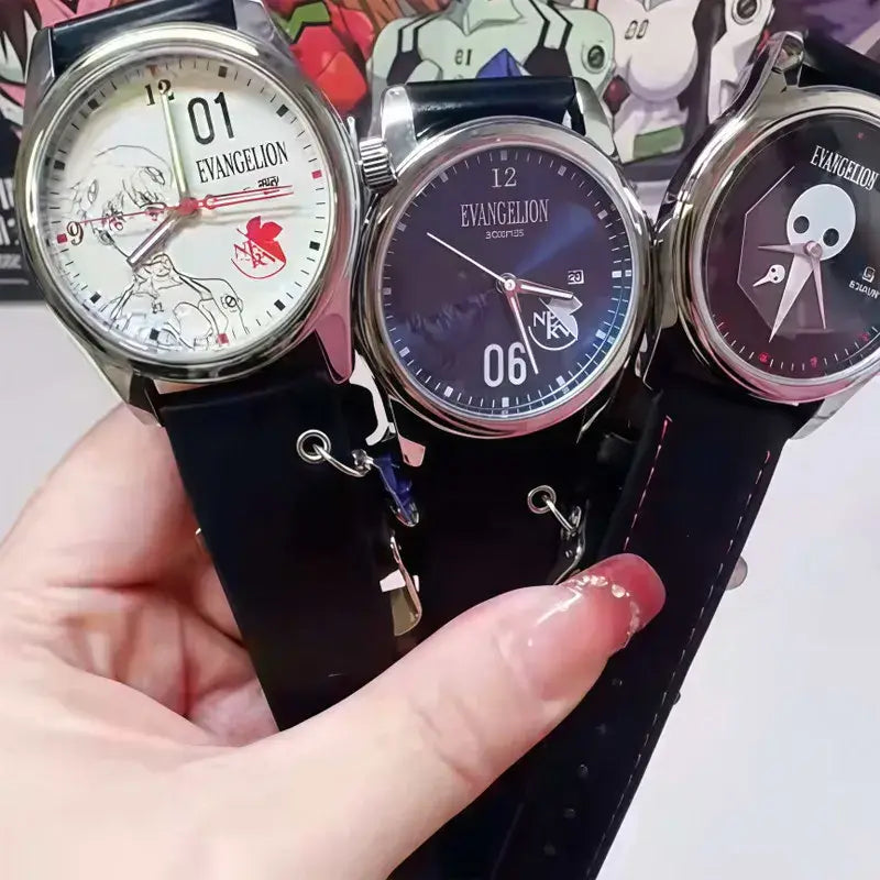 Three evangelion eva blind box watches with black leather straps silver cases and anime character dials including skull motif