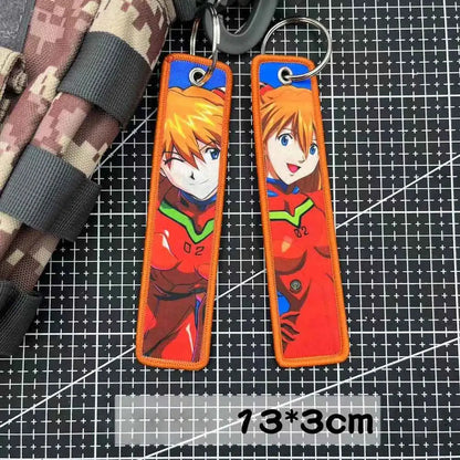 Orange embroidered key tag featuring asuka langley soryu in red and green pilot suit from evangelion keychain accessory