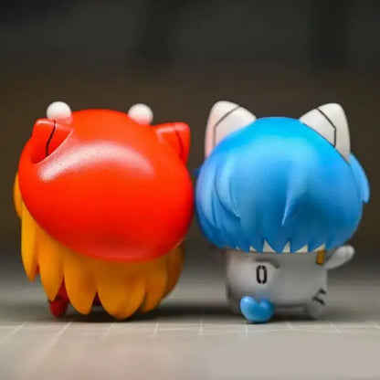 Two chibi-style evangelion rei asuka pvc figures with glossy red and blue tones desktop ornament decoration