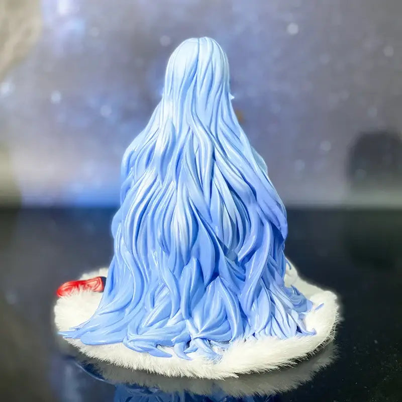 Delicate light blue rei ayanami pvc statue in a kneeling pose with flowing hair on a fluffy white base