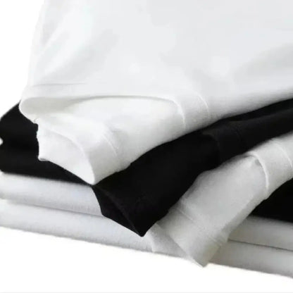 Stack of neatly folded white and black evangelion shinji ikari oversized fit t-shirts made of 100 percent cotton