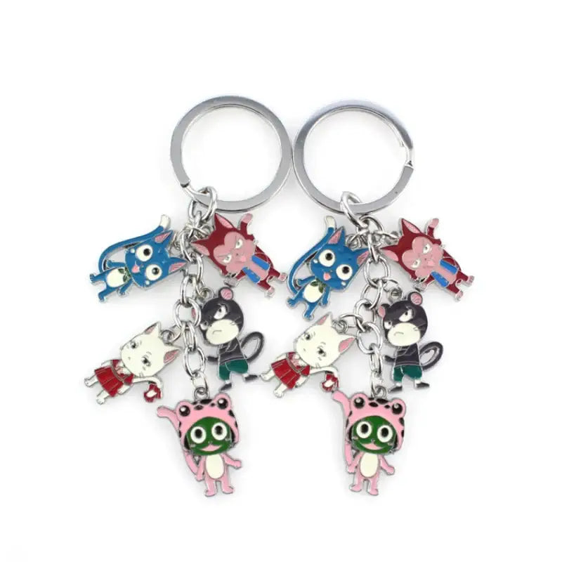 Two silver-toned metal fairy tail key rings with colorful enamel character charms for anime fans