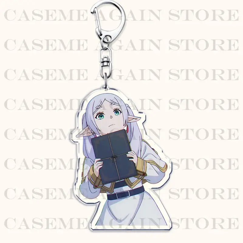 Clear acrylic keychain featuring silver-haired frieren holding a dark blue book as a bag charm from frieren beyond journey’s end