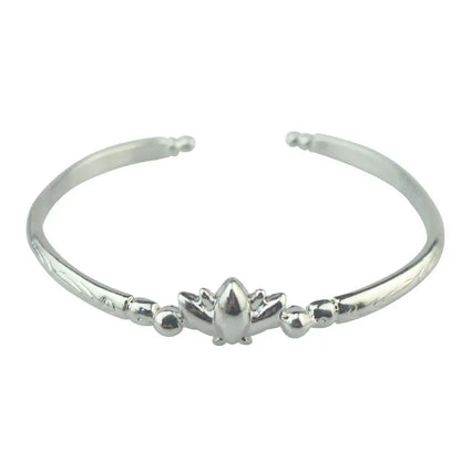 Silver lotus-themed open bangle bracelet with textured zinc alloy bands and small spherical accents from frieren ring collection