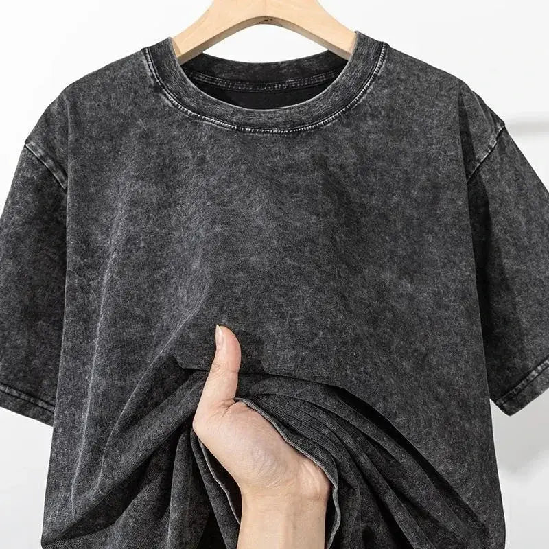 Frieren frieren washed t-shirt is a dark gray vintage washed graphic tee made of soft cotton with a ribbed crew neckline