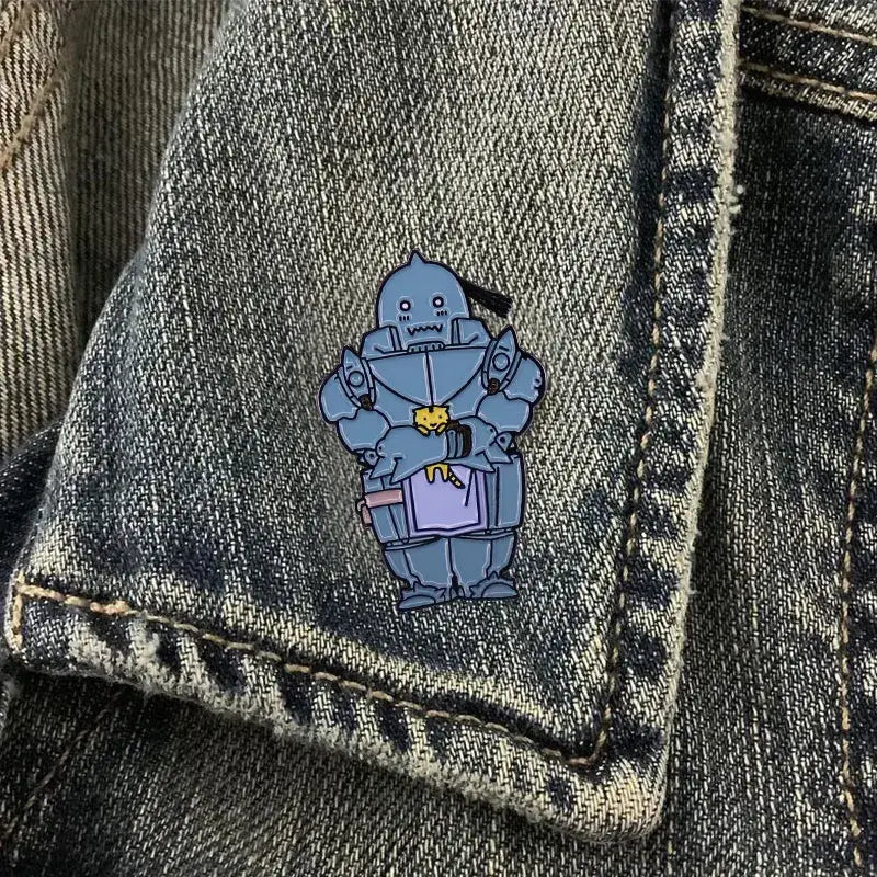 A blue metallic enamel alphonse elric enamel pin featuring a cartoonish armored character with a yellow face