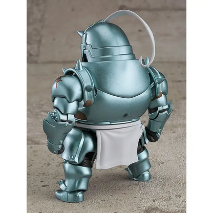 A metallic teal alphonse elric fullmetal alchemist pvc figure with white apron and curved handle shown from the back