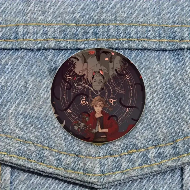 Circular glass brooch pin featuring an anime-style fullmetal alchemist character in red with occult symbols background