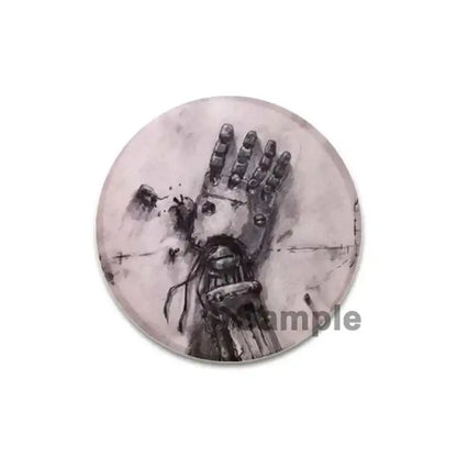 Fullmetal Alchemist brooch pin featuring a detailed black and white mechanical hand illustration on gray enamel
