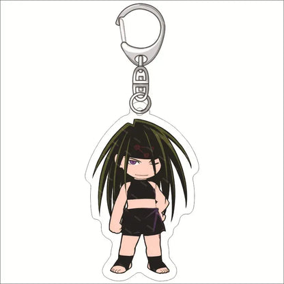 A clear edward elric acrylic keychain featuring a chibi anime character with dark green hair and purple eyes