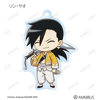 Chibi-style rin yagiri keychain with black hair and yellow flame jacket paired with edward elric acrylic stand