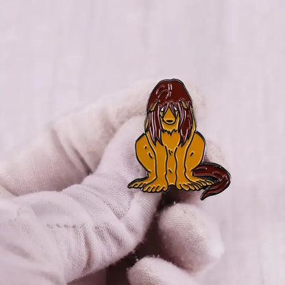 Vibrant orange and red enamel pin featuring a stylized lion mane design from fullmetal alchemist edward elric collection