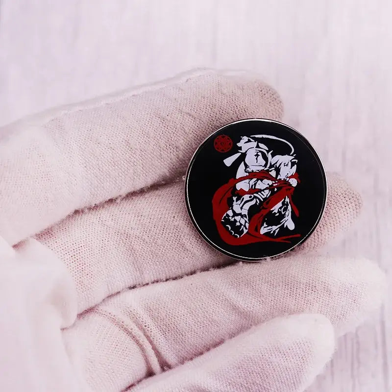 Black enamel pin featuring stylized white and red edward elric ninja figure in dynamic pose fullmetal alchemist badge