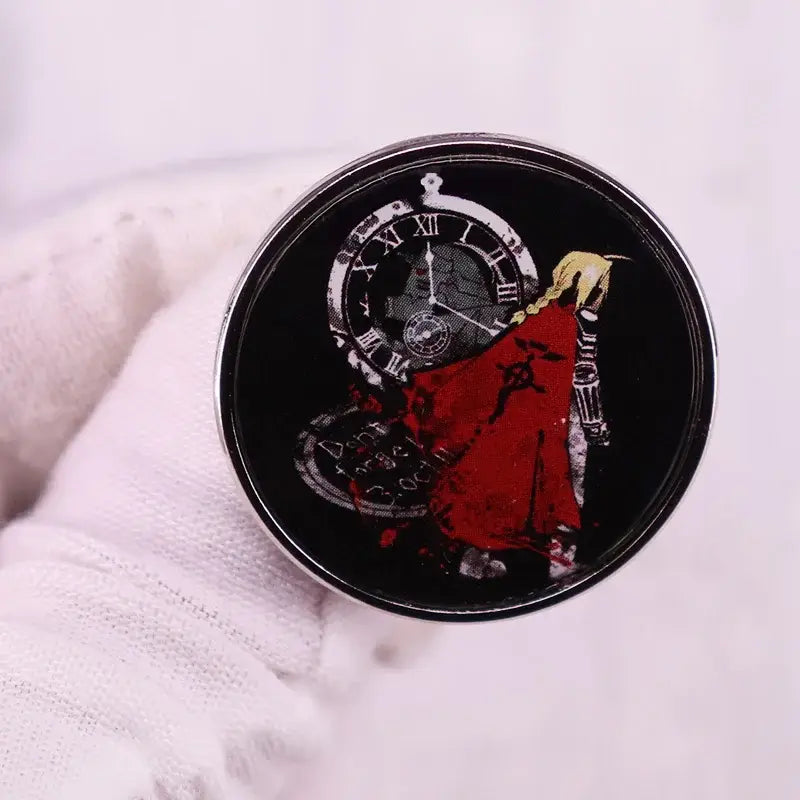 Circular black and silver edward elric enamel lapel pin featuring red-clad figure and roman numeral clock design