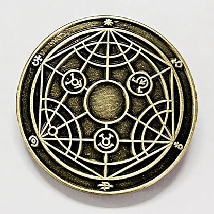 Antique brass-colored circular edward elric enamel lapel pin with intricate geometric and symbolic alchemist designs