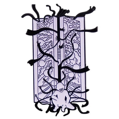 Black and white enamel pin of alchemist edward elric with surreal limbs from open book abstract patterns design