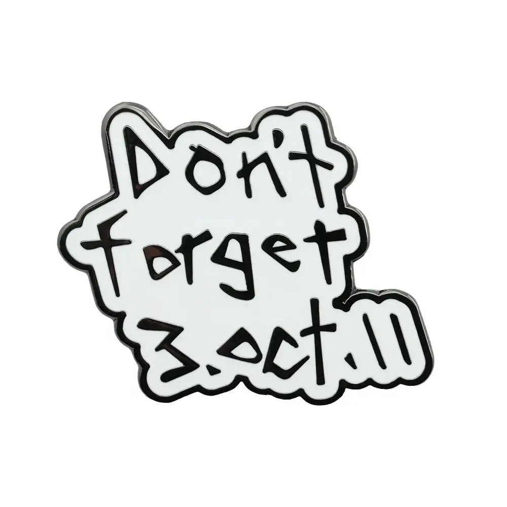 White enamel pin with black outlined text reading dont forget 3.oct.11 in playful font fullmetal alchemist edward elric badge