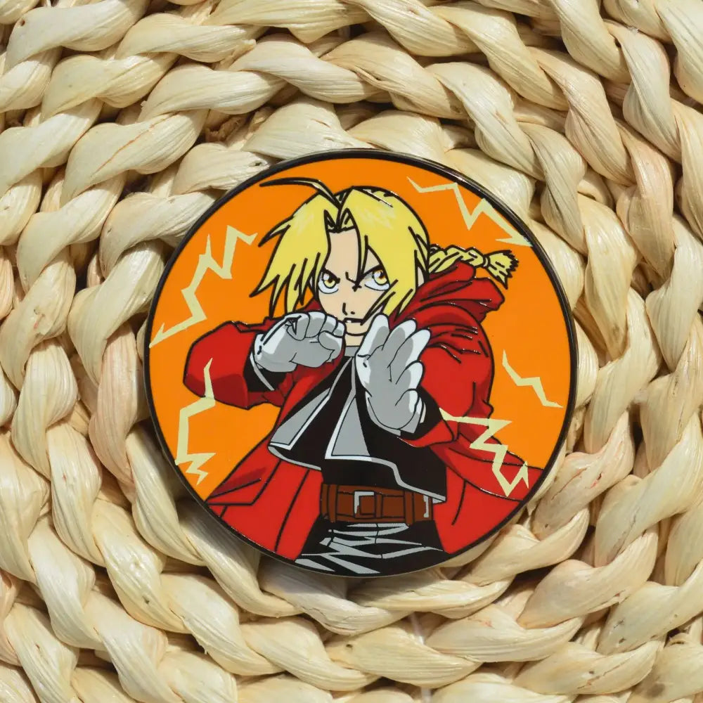 Circular metal badge enamel pin featuring fullmetal alchemist edward elric in red coat with lightning on orange background