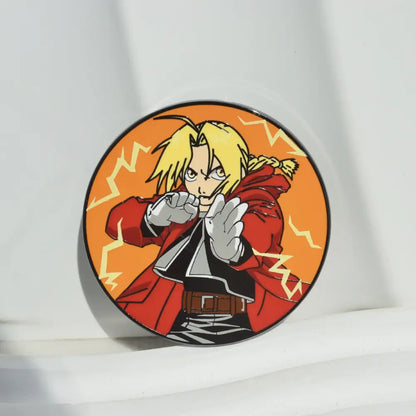 Circular metal badge enamel pin featuring fullmetal alchemist edward elric with blonde hair and red coat