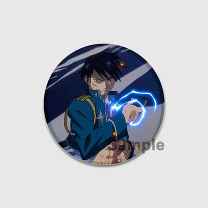 Circular fullmetal alchemist enamel brooch featuring anime character in dark blue uniform holding glowing blue energy