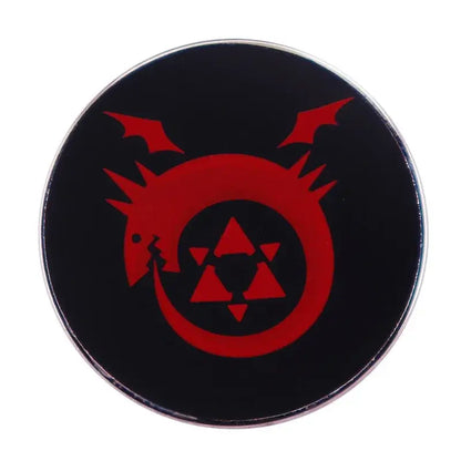 Black circular fullmetal alchemist enamel pin featuring a red dragon emblem with triangular patterns brooch badge