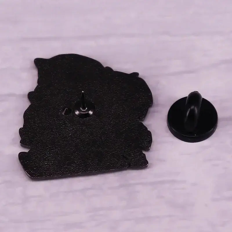 Black fullmetal alchemist enamel pin shaped like a stylized bear silhouette with textured finish brooch badge