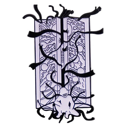 Black and white fullmetal alchemist enamel pin featuring surreal multi-limbed figure on open book brooch badge