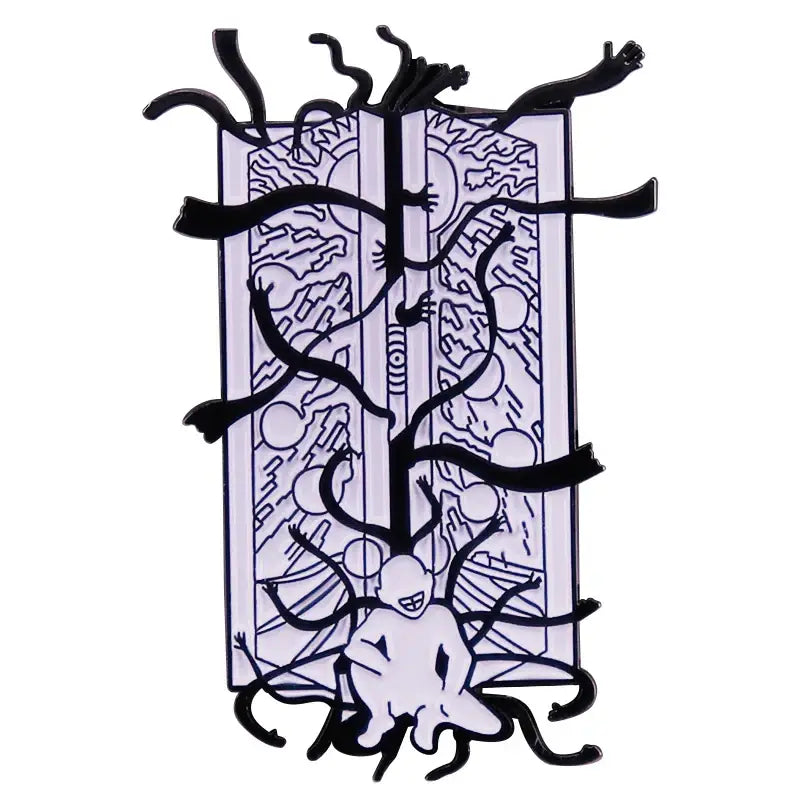 Black and white enamel pin featuring a surreal fullmetal alchemist gate of truth design on an open book background
