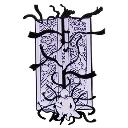 Black and white enamel pin featuring a surreal fullmetal alchemist gate of truth design on an open book background