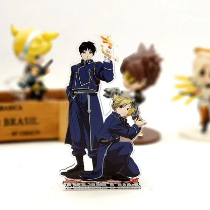 Fullmetal alchemist roy mustang acrylic stand featuring two blue and white military-style figures with fire emblem design
