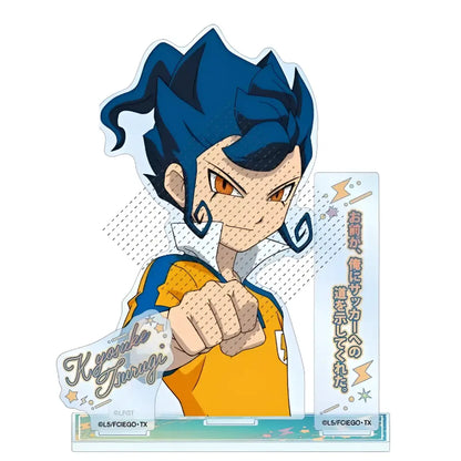 Blue-haired anime character figurine with orange eyes in yellow-orange jersey on acrylic base from inazuma eleven game stand