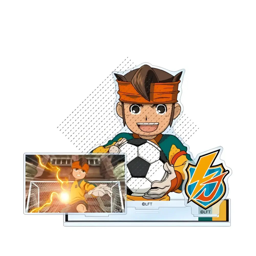 Clear acrylic stand featuring a smiling cartoon soccer player in green jersey and orange headband holding a soccer ball with vj logo