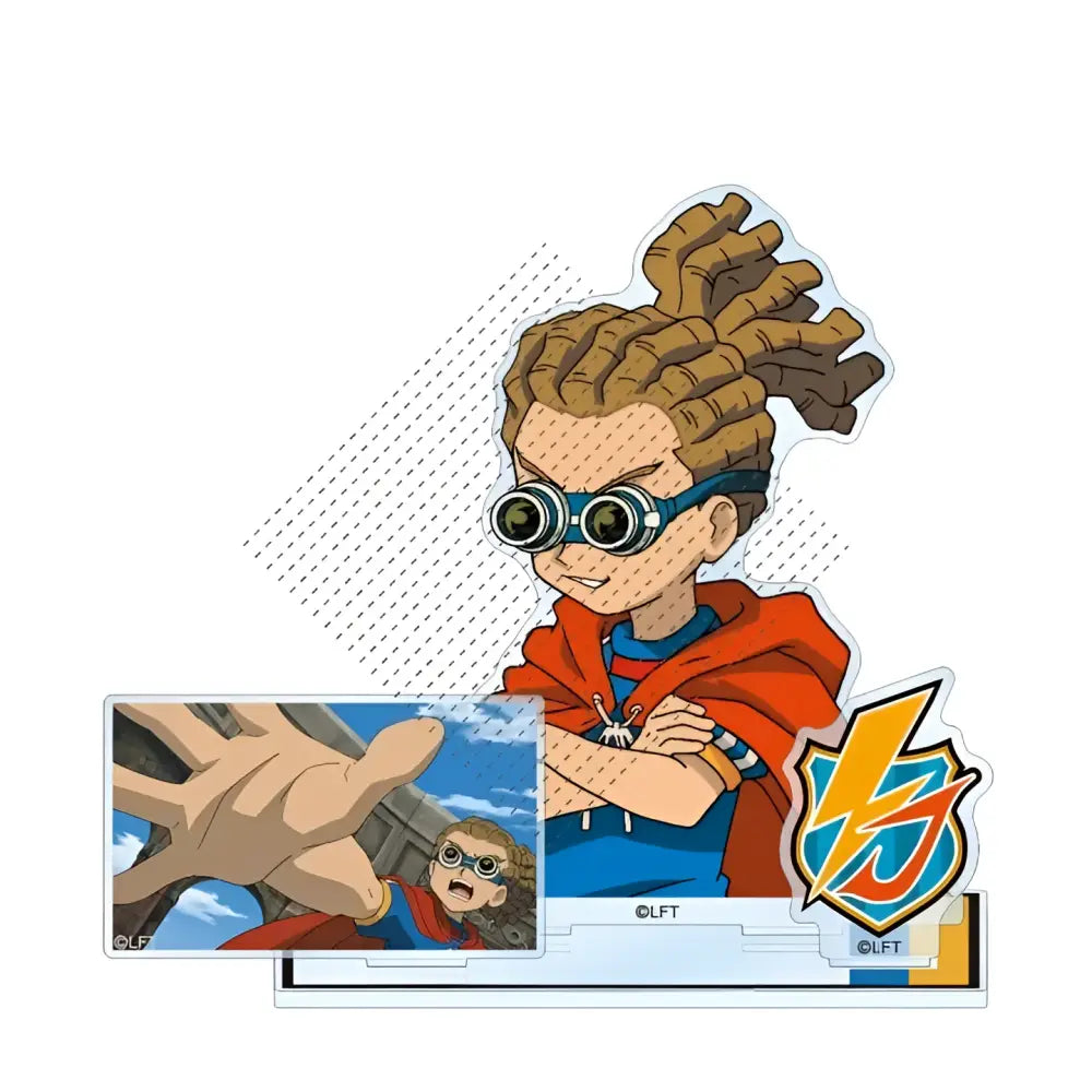 Acrylic standee of a cartoon character with brown dreadlocks blue goggles and orange cape from game inazuma eleven 11
