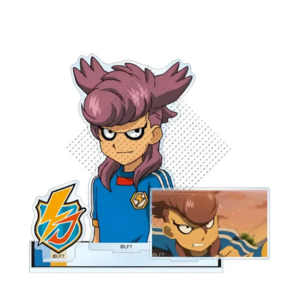 A clear acrylic stand featuring a cartoon character with spiky purple hair wearing a blue sports jersey from game inazuma eleven 11
