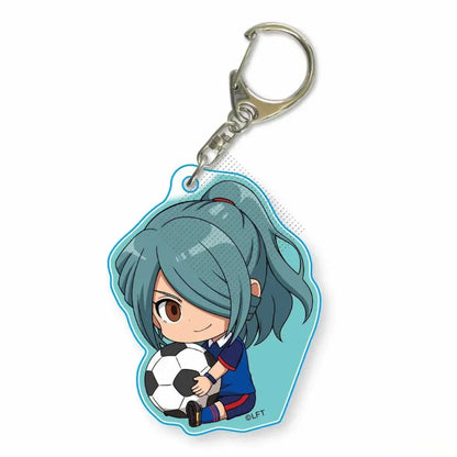 A translucent blue acrylic keychain featuring a chibi anime character asuto inamori holding a soccer ball with metal clasp