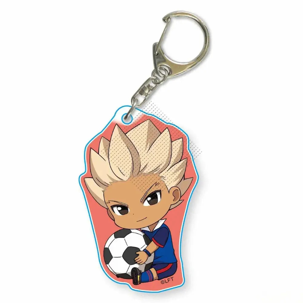 Chibi-style acrylic keychain of blonde anime soccer player asuto inamori in blue uniform holding black and white ball