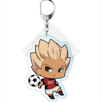 Chibi-style acrylic keychain of shoya fubuki from game inazuma eleven with spiky blonde hair holding a soccer ball