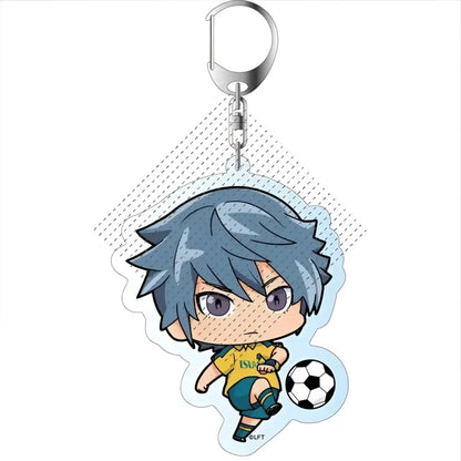 A blue-haired chibi soccer player acrylic keychain from game inazuma eleven with yellow jersey and black and white ball