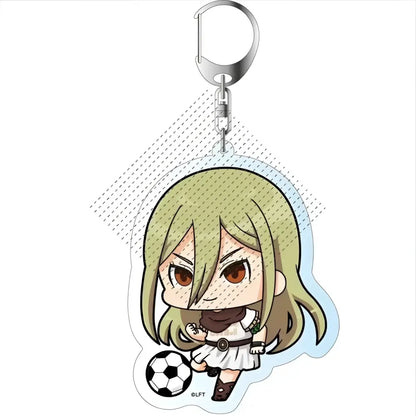Chibi-style acrylic keychain of blonde anime girl in white soccer uniform holding a black and white soccer ball from game inazuma eleven 11