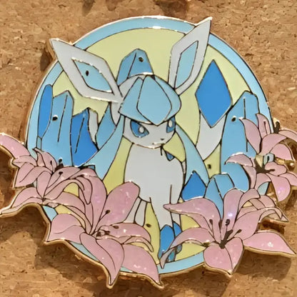A circular enamel pin featuring glaceon with blue and white colors and pink lilies, ideal for gengar anime elf fans
