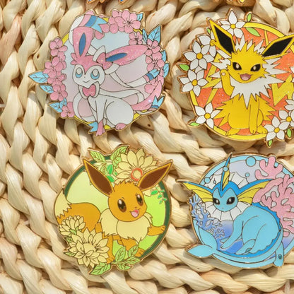 Four colorful enamel pins featuring sylveon jolteon eevee and glaceon with floral designs for gengar anime elf cosplay