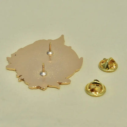 Gold-colored metal pin shaped like a stylized leaf with two fasteners showing the back of gengar anime elf enamel pin