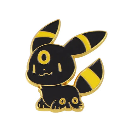 Black and yellow umbreon anime enamel pin with gold-trimmed edges featuring kawaii elf enamel finish design