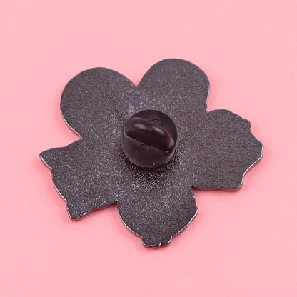 Black enamel pin shaped like a five-petaled flower with matte enamel finish and dark plastic clasp for kawaii elf anime enamel design