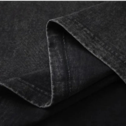 Black denim fabric with worn texture and stitching detail on the folded edge of gengar ghost oversized 100 percent cotton t shirt