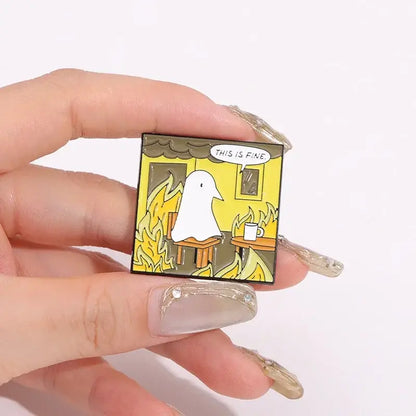 Square goodnight punpun enamel pin featuring a white ghost in yellow flames with this is fine text metal brooch