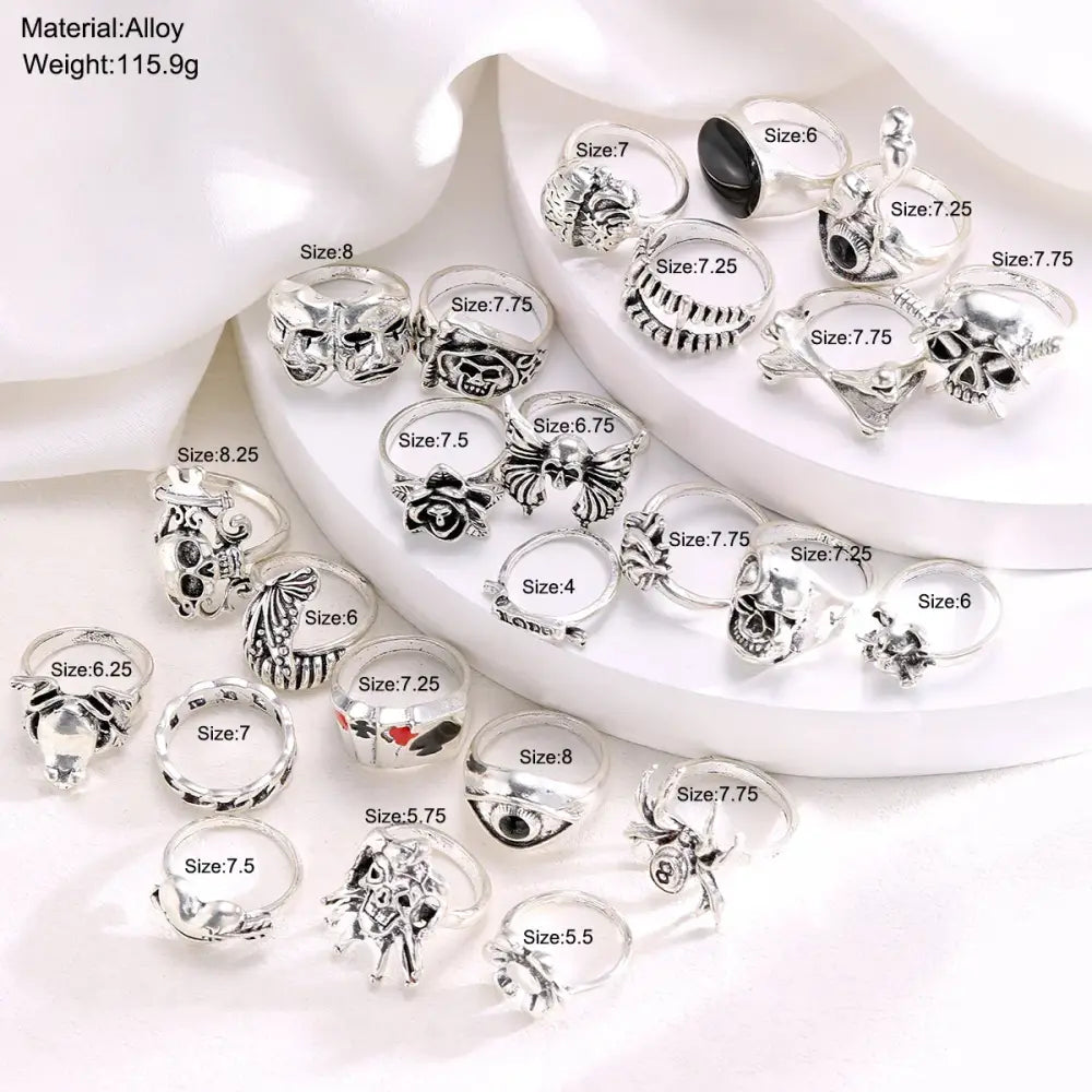 Silver alloy skull-themed ring set with black accents in various sizes gothic skeleton punk jewelry collection